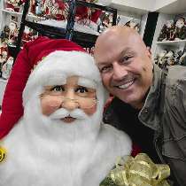 TCWGlobal photo of: Our CEO, Samer, posing with Santa and our Santa and Salsa event.