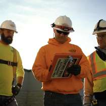 Torgeson Electric photo of: Torgeson Electric workers planning on a job site.