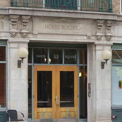  photo of: Detail of the 55 Davis Square entrance to the Hobbs Building