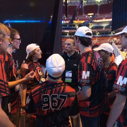  photo of: Our CEO & President Kelly Ortberg gives a pep talk to FRC#967 Iron Lions from Linn-Mar High School at the FIRST World Championships in St. Louis, MO.
