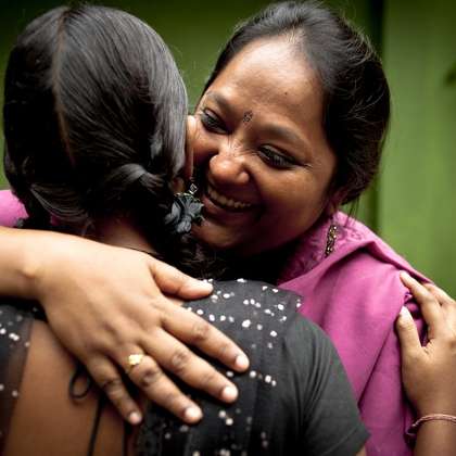  photo of: A client greets her IJM social worker in one of our India field offices